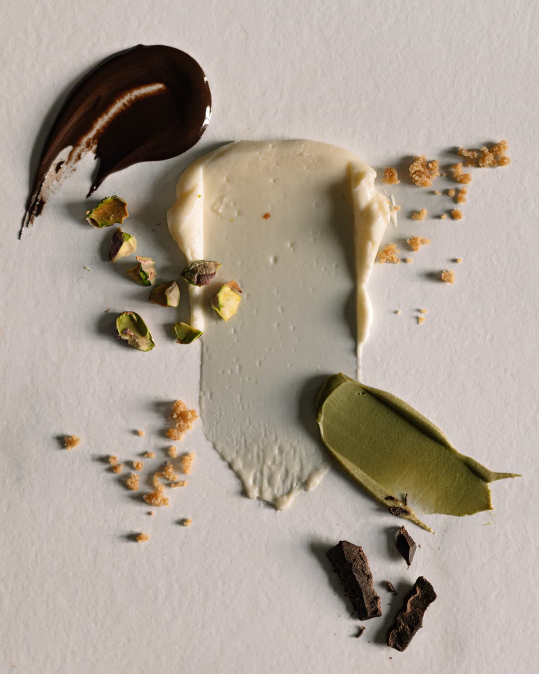 swatches of the components for a pistachio cheesecake brownie.