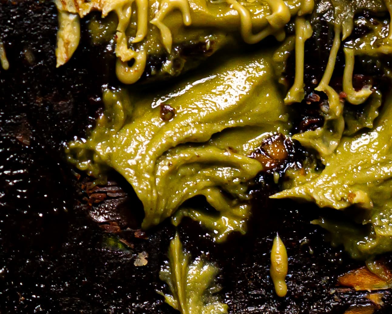 oozing pistachio out of a pistachio cheesecake brownie